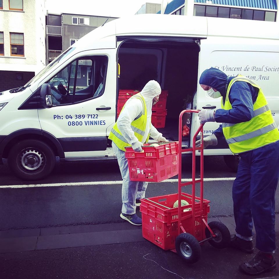 Vinnies volunteers loading food parcels for delivery